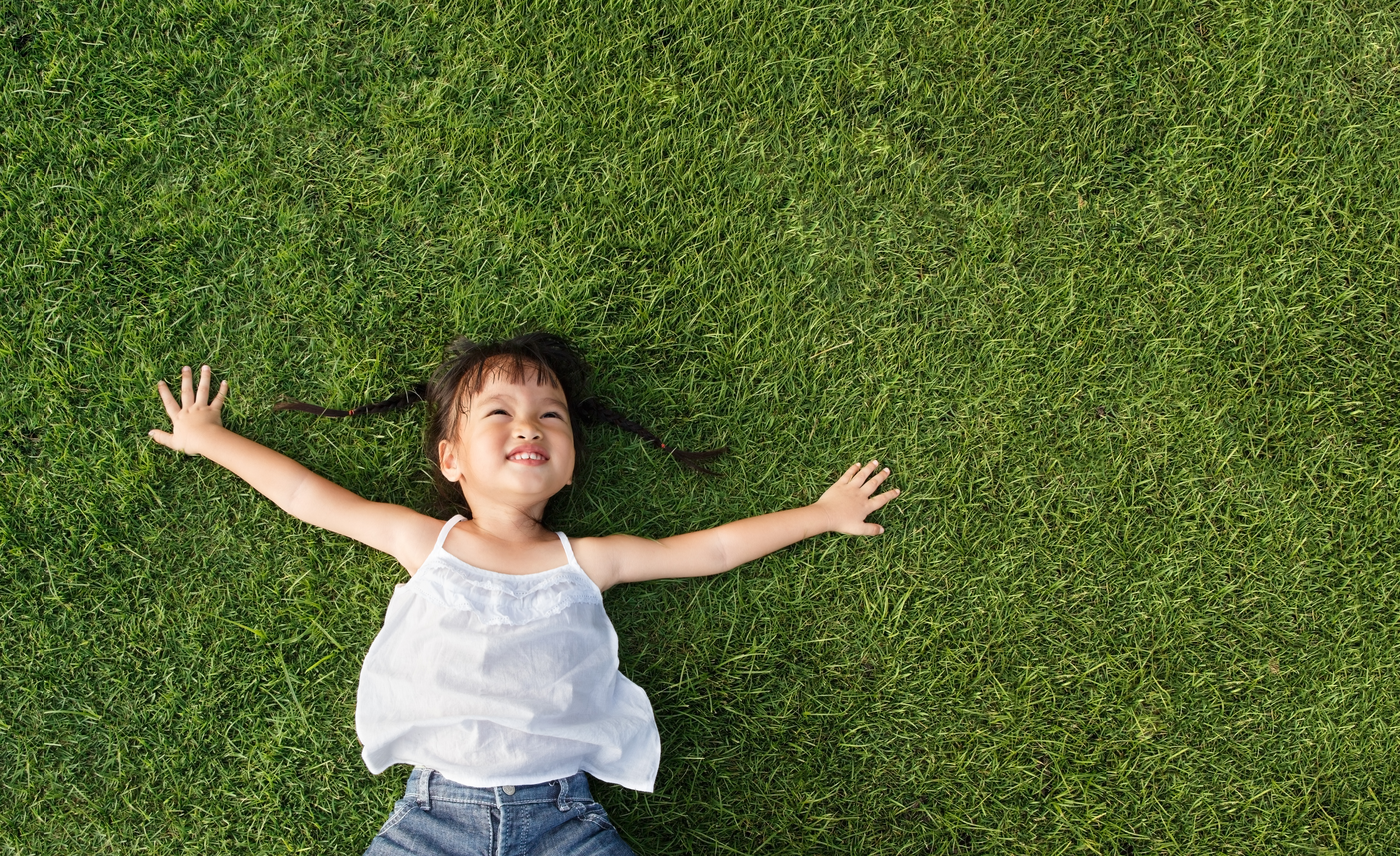 Girl laying on grass