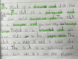 Writing in a school book with green highlights