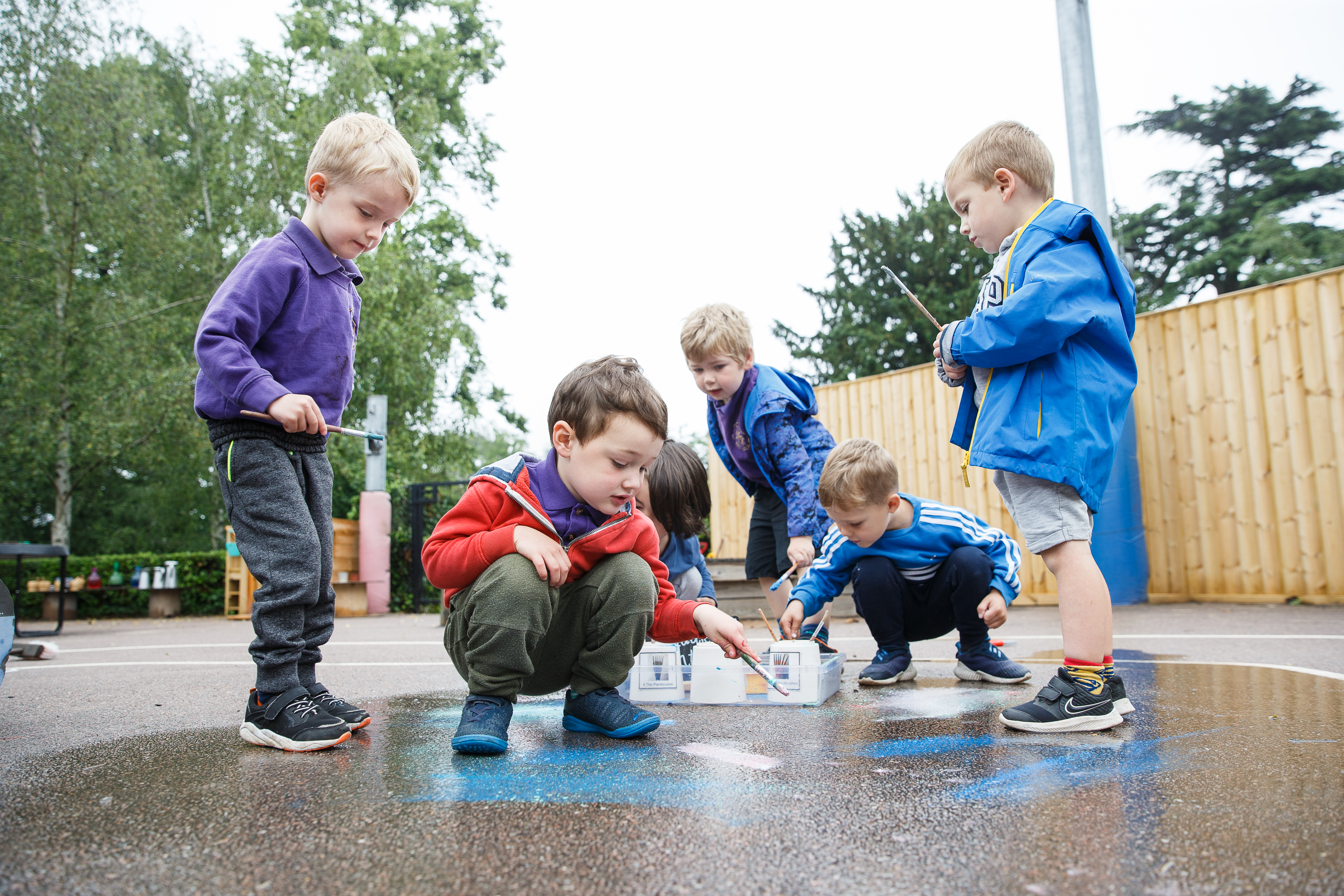 Children painting on the floor