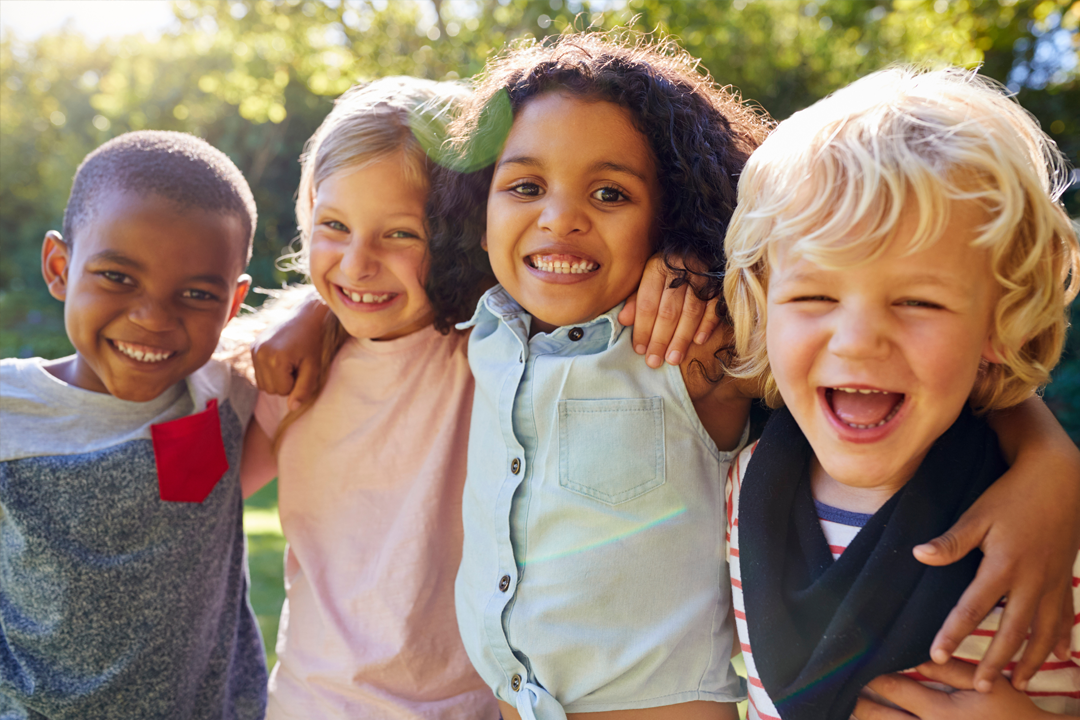 Happy looking Early Years children together