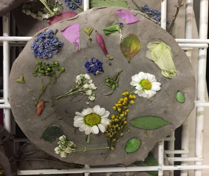 Pressed flowers in clay