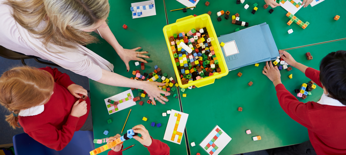 Children in class with building blocks