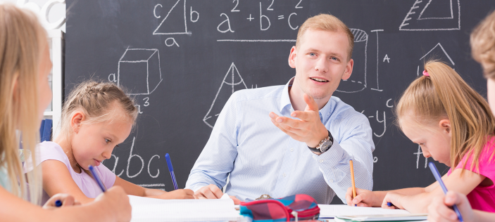 Teacher talking to pupils