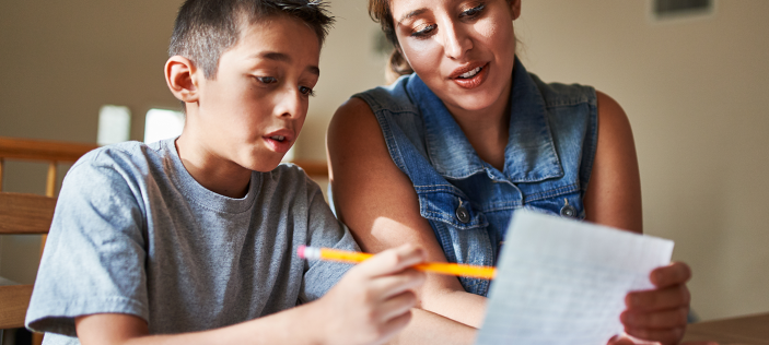 Parent and child looking at school work