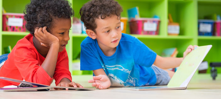 two children looking at a book