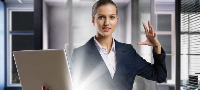 Business woman with glowing laptop