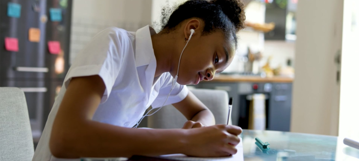 Girl writing in book