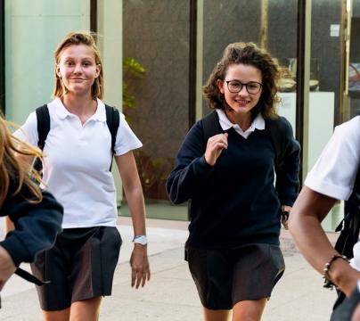 group of secondary school age children leaving school