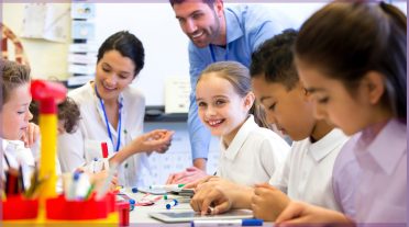 teacher with a group of children in classroom