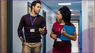 man and a woman in a school corridor