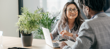 Digital strategy for education settings: A new frontier for school improvement People dressed smartly in conversation with one another. A potted plant is on a desk