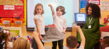 Why teach oracy? Children displaying model volcano in-front of class