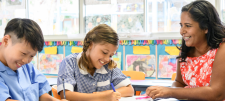 Developing greater depth thinking with these festive maths challenges Pupils with teacher in classroom