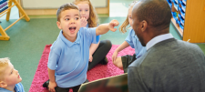 Reading re-envisaged - revisited Happy looking children in classroom